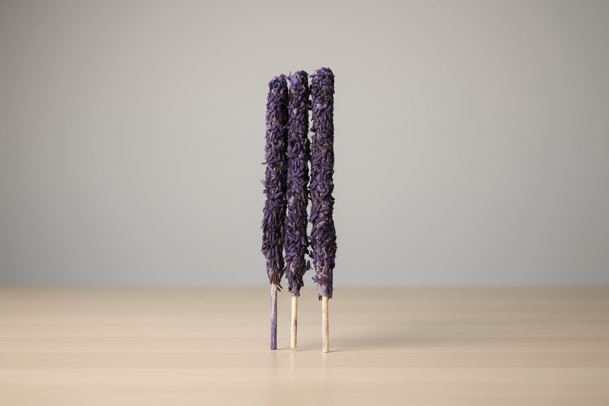 Three lavender smudge sticks displayed against a white background, intended for use in supporting children's education and combating insomnia.