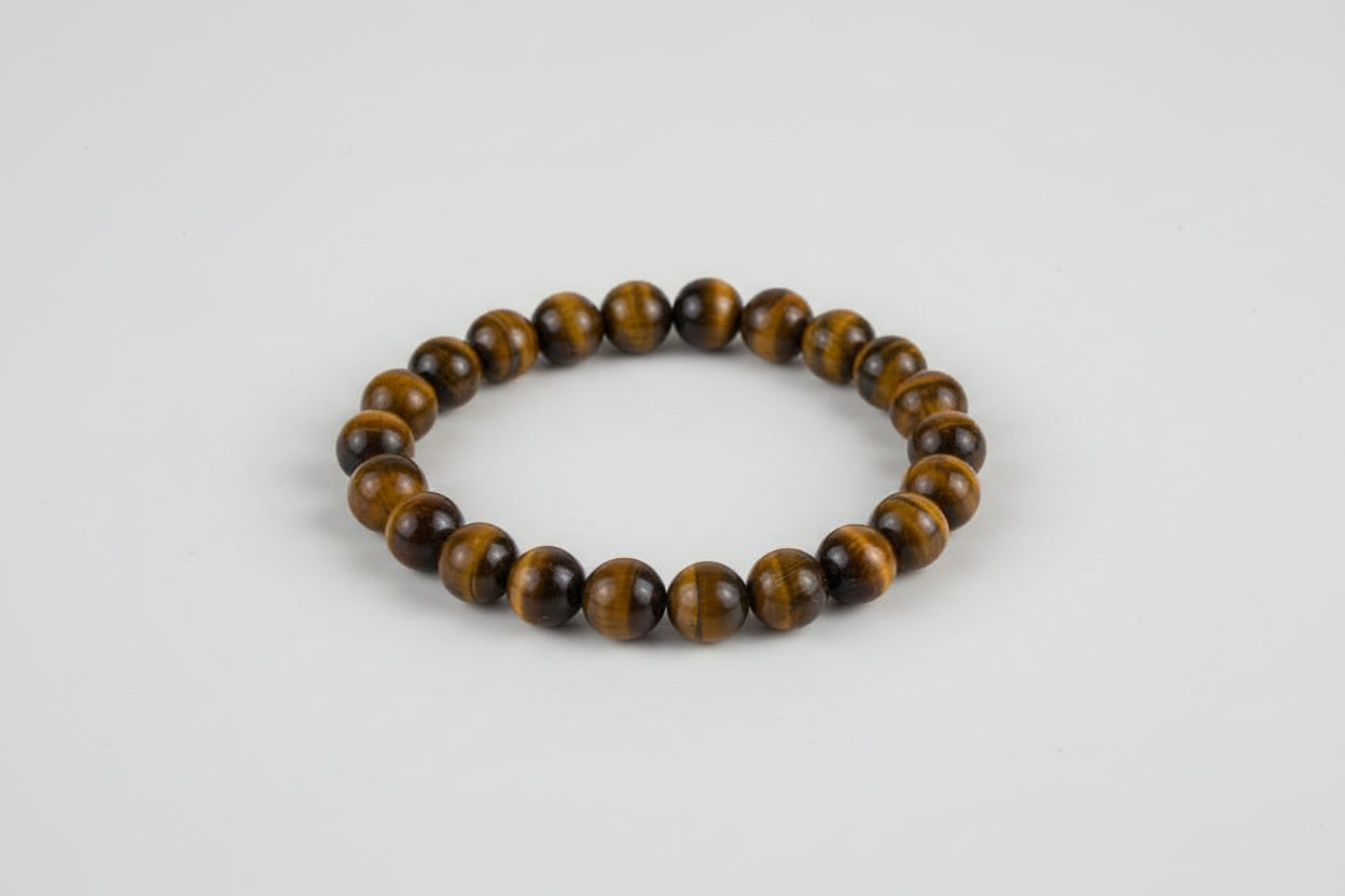 A Tiger's Eye bracelet displayed alongside a floral arrangement with the bracelet's name and price mentioned in the image.