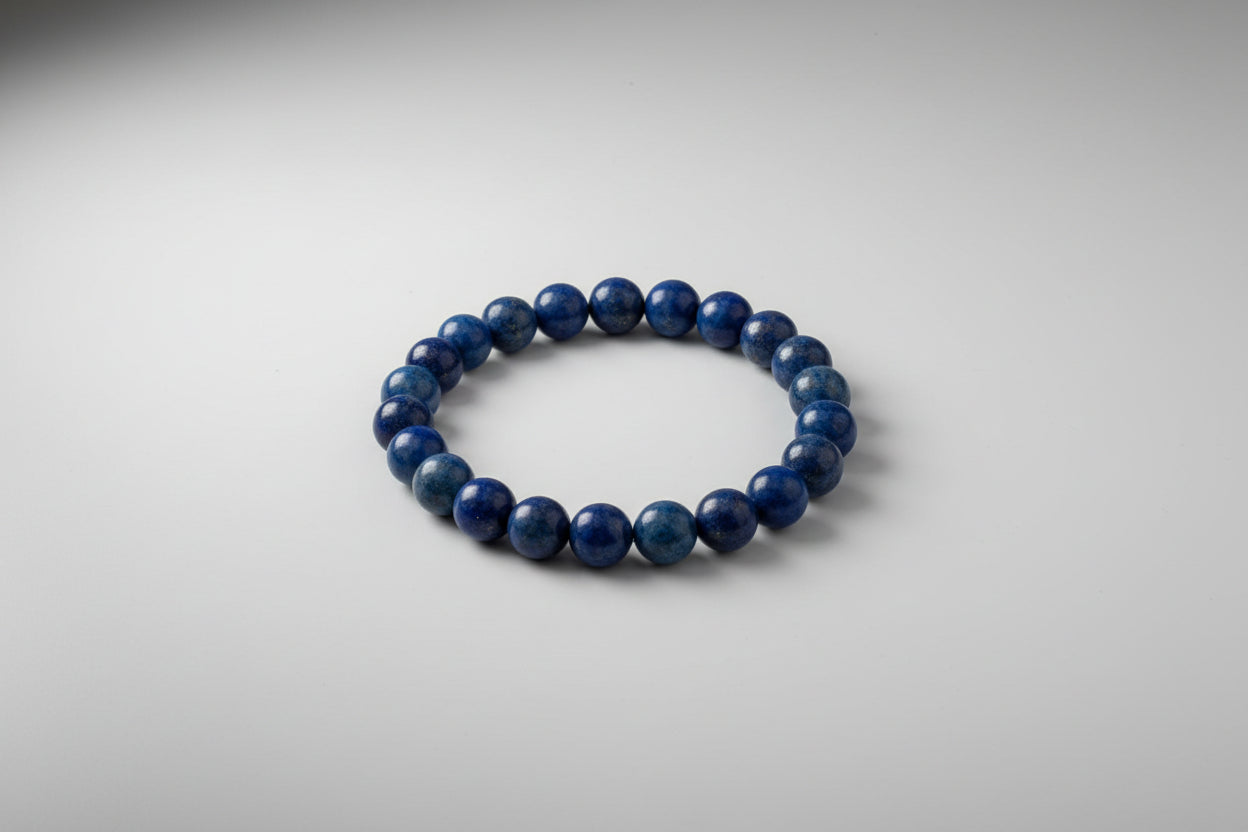 A promotional image featuring a Lapis Lazuli bracelet with text highlighting its benefits such as enhancing communication, supporting thyroid health, and improving focus.