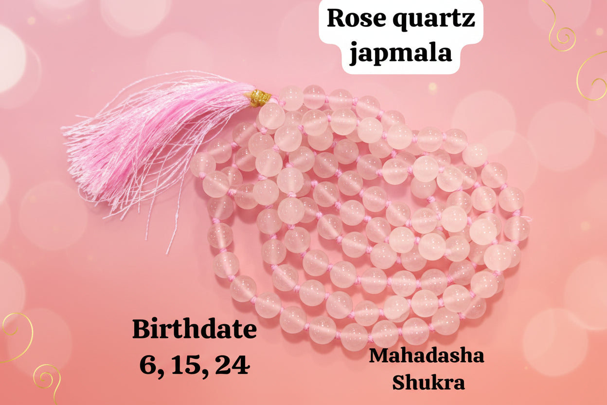 A rose quartz japmala with a pink tassel, beads appear round and translucent, with markings indicating it's associated with birthdates 6, 15, 24 and Mahadasha Shukra.
