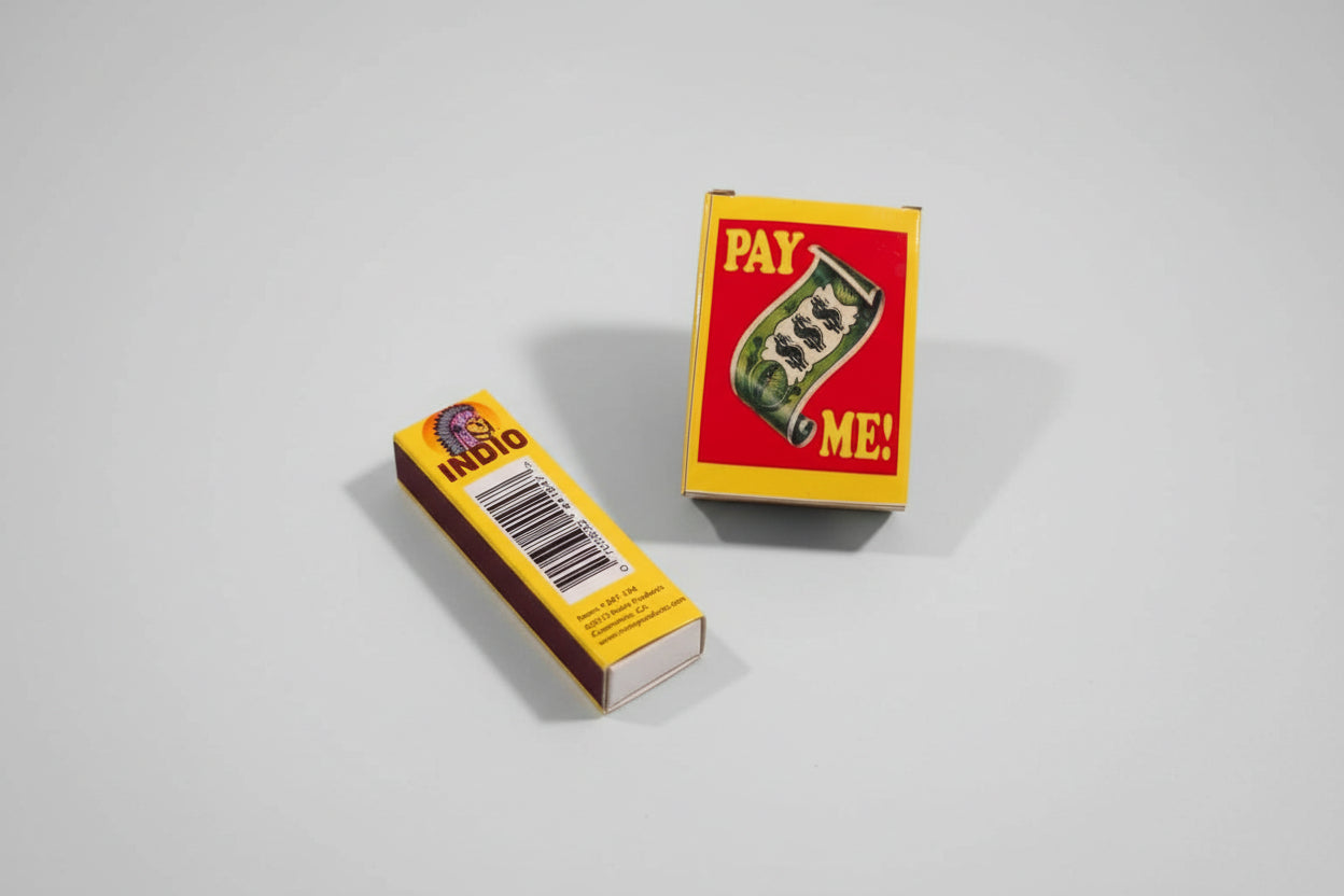 The image shows two views of a bar of soap. One view is the top of the soap with the text 'PAY ME' in bold letters, and the other view is the side of the soap with a barcode and additional product information.