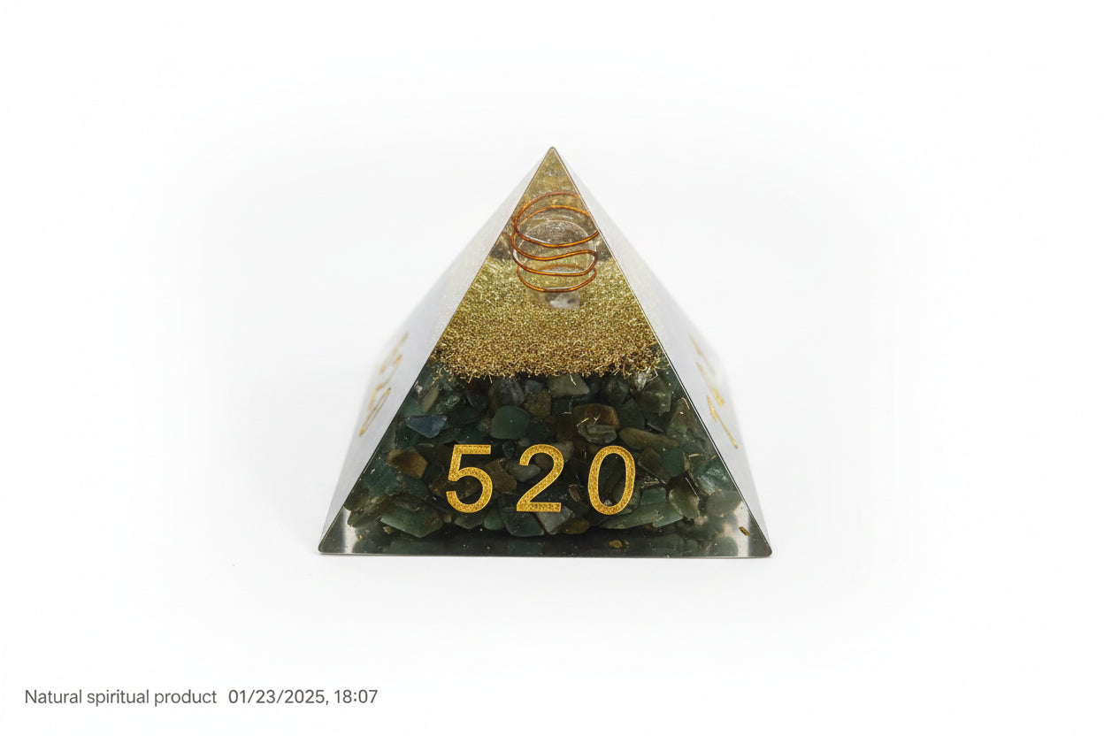 A green aventurine pyramid with numbers and a symbol on it, placed on a red surface.