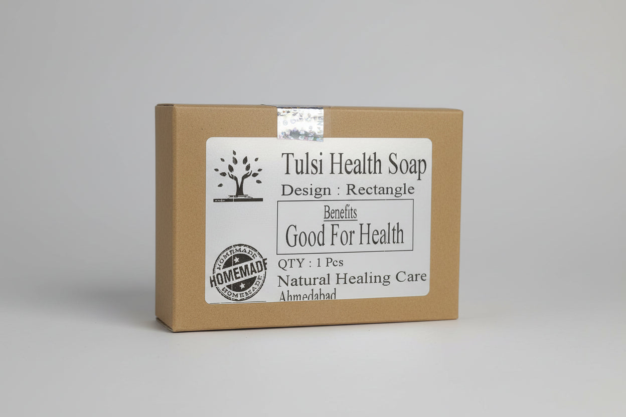 Packaging of Tulsi Health Soap with a label that includes the brand name and benefits such as 'Good For Health'. The packaging is in a natural brown color with a tree logo, indicating it is a product of Natural Healing Care.