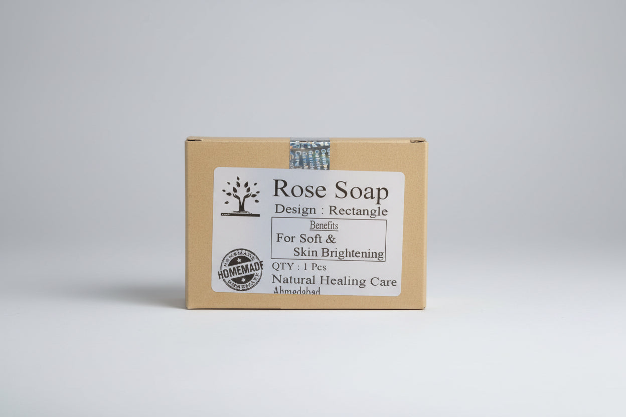 A packaged bar of Rose Soap with a label detailing the benefits such as softening skin, brightening complexion, anti-aging, soothing irritation, and providing a natural fragrance.
