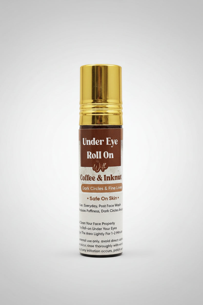 A bottle of Under Eye Roll-On with a label that includes the product name and mentions 'Coffee & Inknut'. The bottle is gold in color with a white label and text.