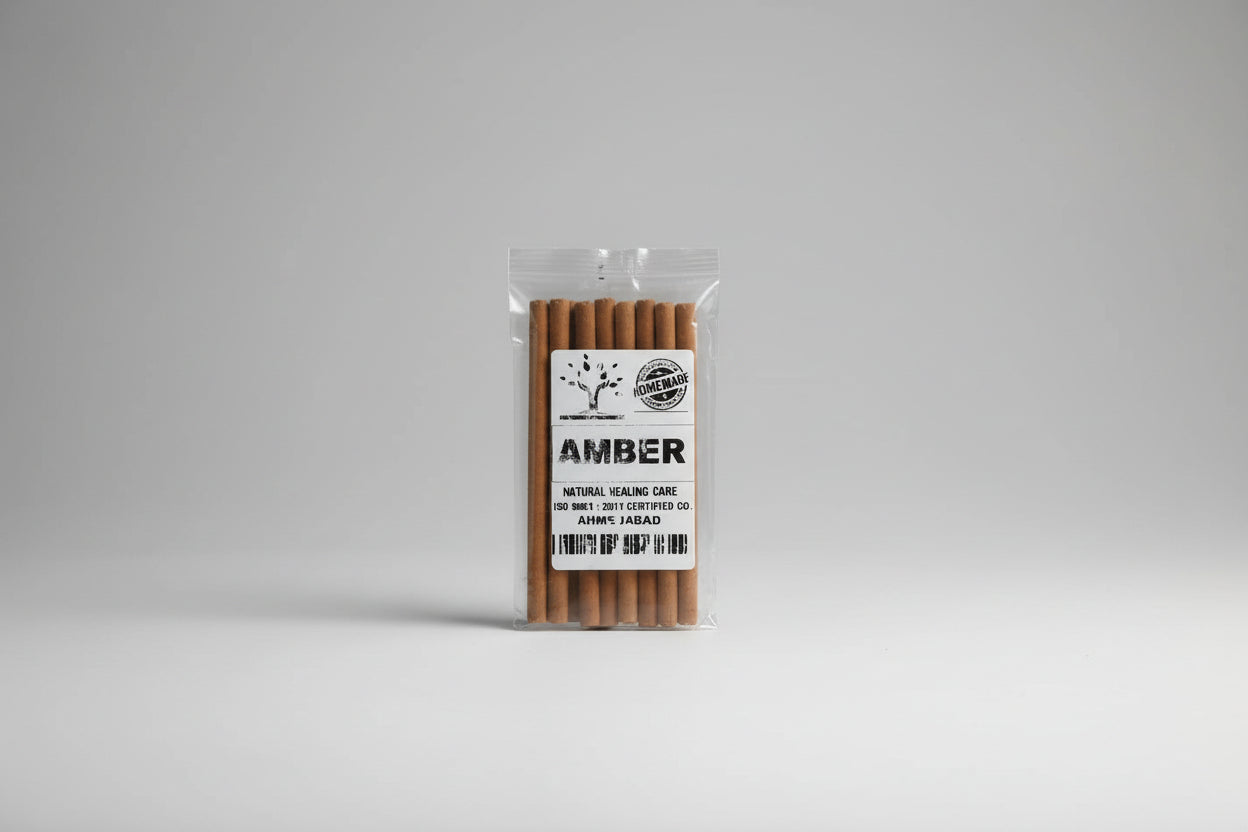 A pack of amber dhoop sticks, with each stick visible through the clear plastic packaging, labeled for natural incense care.