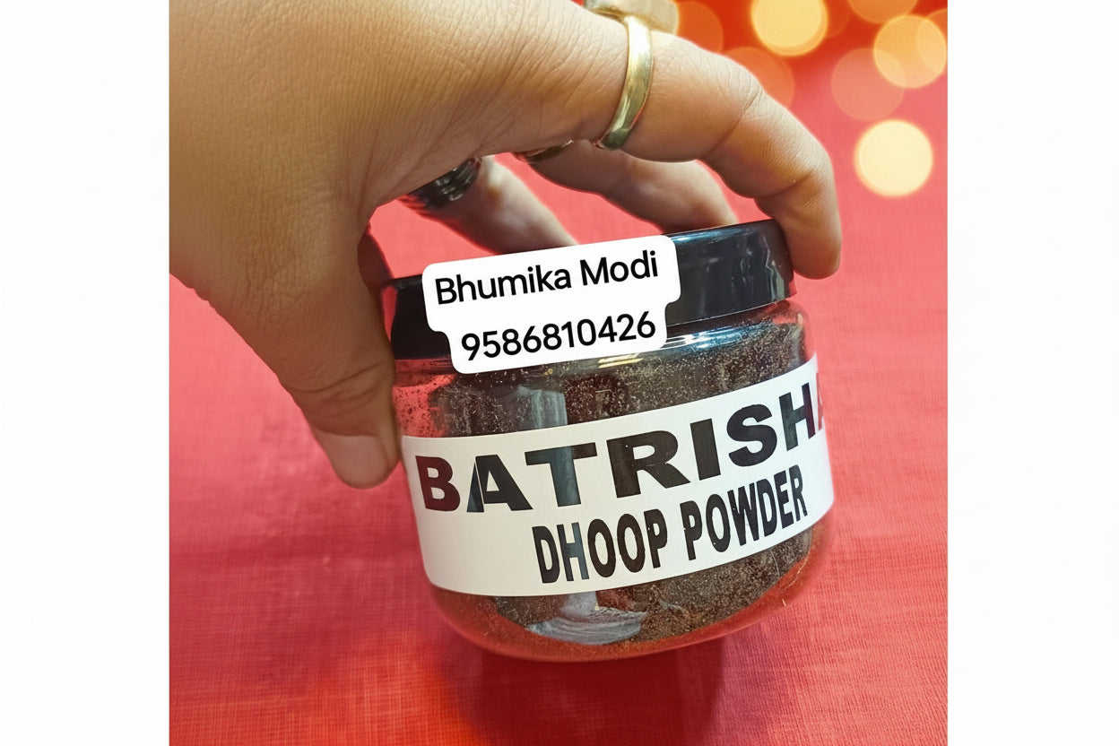 A jar labeled 'BATRISHA DHOOP POWDER' held in a person's hand, with a red background.