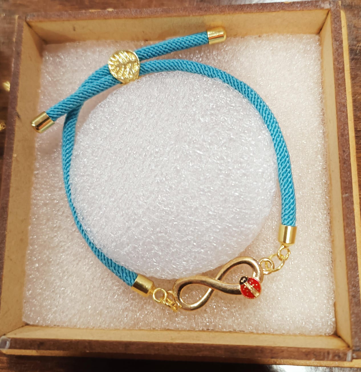 Blue Thread Infinity Bug Bracelet