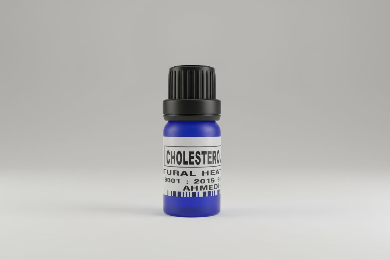 A small blue bottle labeled 'CHOLESTEROL DROPS' on a wooden surface.