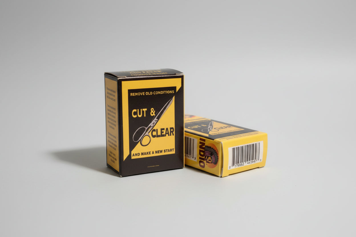 The image shows a packaged bar of Cut and Clear Soap with a design featuring pink apple graphics and a yellow label.