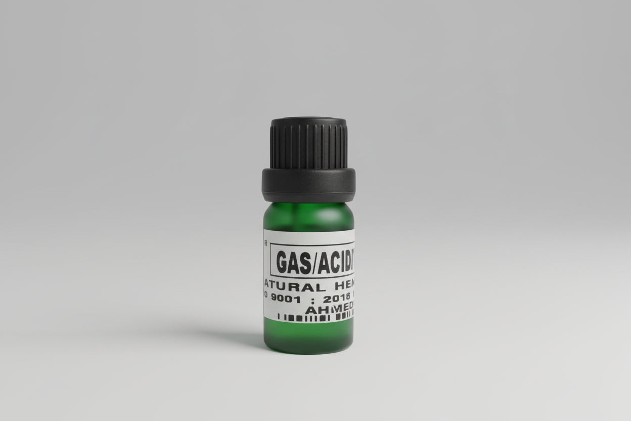 A small bottle labeled 'GAS/ACIDITY drops' placed on a wooden surface, presumably containing a dietary supplement for digestive relief.