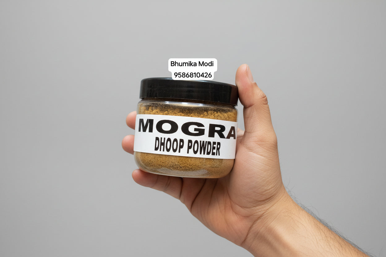 A container of Mogra Dhoop Powder held in a person's hand, with a label that includes the product name and contact information.